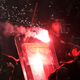 Illustration for article titled Smoke, Flares, Riot Police In Belgrade Derby Make For Haunting Photos